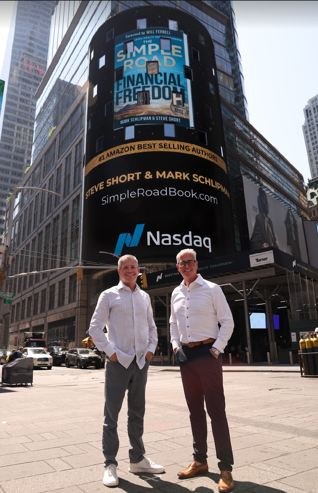 Steve Short and Mark Schlipman in Times Square with a book billboard behind them